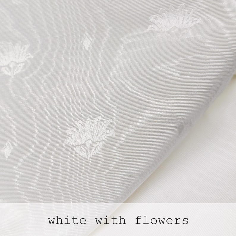 white moire fabric with small jacquard flowers