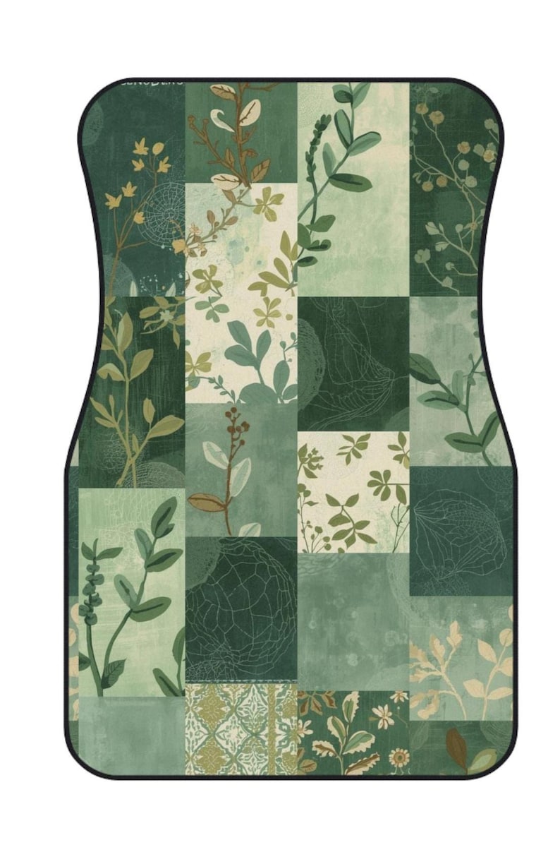 May include: A rectangular car floor mat with rounded corners and a black border, featuring a patchwork design of various shades of green and cream. The pattern consists of botanical illustrations of leaves, stems, and intricate line-drawn textures.