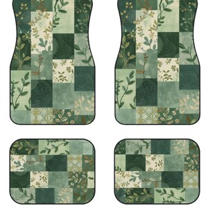 May include: A set of four car floor mats featuring a patchwork design in various shades of green. The pattern consists of rectangular blocks displaying botanical illustrations of leaves, branches, and subtle geometric textures with black borders.