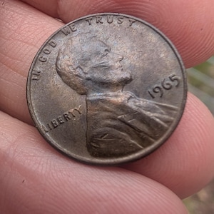 Lincoln Penny de 1965, error "L", sin marca de ceca