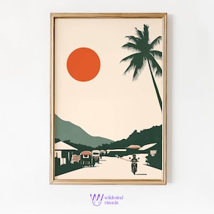 May include: A framed print of a minimalist landscape with a large orange sun, a palm tree, and a road with vehicles and a person on a motorcycle. The background is a green mountain range.