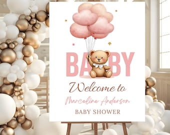 May include: A baby shower sign featuring a teddy bear holding pink cloud-shaped balloons. The word "BABY" is in pink, with "Welcome to Marceline Anderson BABY SHOWER" below. The sign is on an easel.