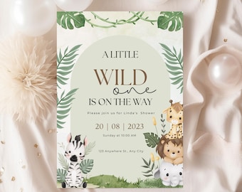 May include: A green and brown baby shower invitation with a jungle theme. The invitation says "A Little Wild One Is On The Way" with a date and time for the shower. The invitation features a zebra, lion, giraffe, and elephant.