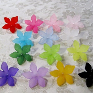 May include: Assortment of 14 plastic flower beads in various colors, including red, pink, light blue, green, purple, yellow, white, and black.