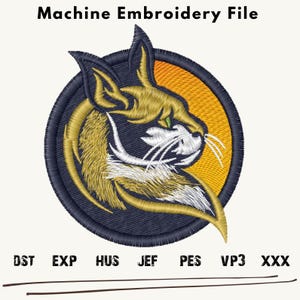 May include: Machine embroidery file design of a cat's head in gold, white, and black, with a green eye, set against a blue circle with an orange sunburst background. The file formats are listed below: DST, EXP, HUS, JEF, PES, VP3, XXX.