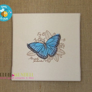 May include: A white ceramic tile with a blue butterfly illustration and the text "Fig. 5 Morpho peleides".