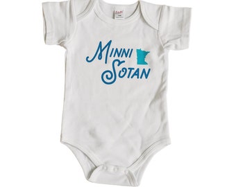 May include: White baby onesie with a blue and teal graphic of the state of Minnesota and the text "MinniSotan".
