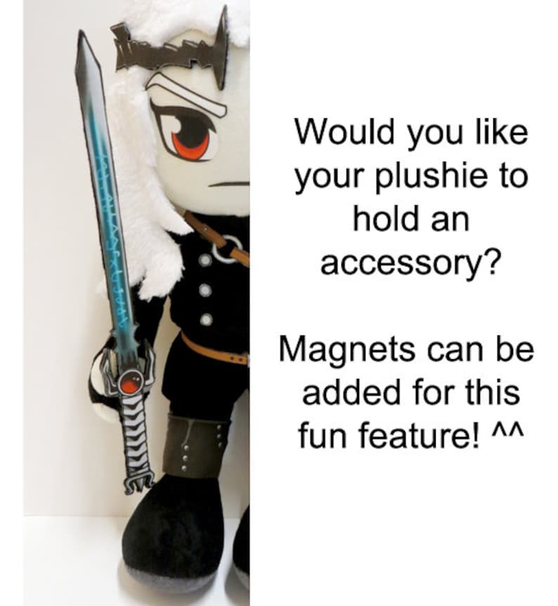 May include: A plush toy with white hair and a black outfit holding a blue and silver sword. The toy has red eyes and a crown. The text "Would you like your plushie to hold an accessory? Magnets can be added for this fun feature! ^^" is visible in the image.