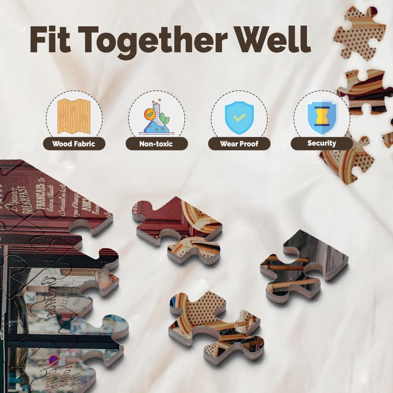 May include: A partially assembled jigsaw puzzle with pieces scattered around. The puzzle pieces feature images of text and patterns. The text "Fit Together Well" is at the top. Icons indicate wood fabric, non-toxic, wear proof, and security.