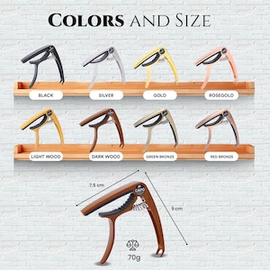 May include: A capo for guitar with a variety of colour options, including black, silver, gold, rose gold, light wood, dark wood, green bronze, and red bronze. The capo is 7.5 cm wide and 9 cm long and weighs 70 grams.