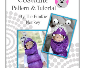 May include: A purple and white costume for a baby, inspired by the character Boo from the movie Monsters Inc. The costume includes a hooded vest with a furry collar and large, round eyes. The text "Boo Monster Costume Pattern & Tutorial By The Punkie Monkey" is visible at the top of the image.