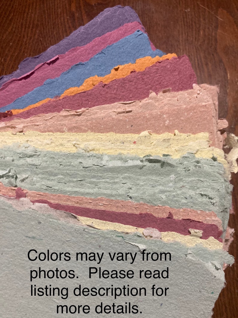 May include: A stack of handmade paper sheets in various shades of blue, purple, pink, yellow, and green. The paper has a textured, handmade look. Colors may vary from photos. Please read listing description for more details.