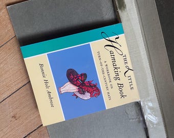 May include: The Little Hatmaking Book, a workbook on turn-of-the-century hats, by Bonnie Holt Ambrose. The book cover features a colorful illustration of a vintage hat on a light blue background.