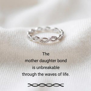 May include: A rustic wooden sign with the text "Welcome to our home" in a handwritten style. The sign features a distressed finish and a simple, inviting design, perfect for front door decor.