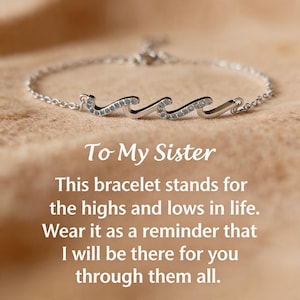 May include: A silver bracelet with a wave design, adorned with small, light blue stones. The bracelet is on a neutral background. Text on the image reads "To My Sister" and a message about support.