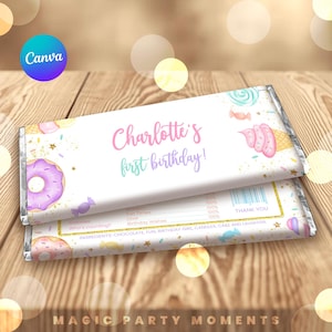 May include: Two rectangular chocolate bar wrappers featuring a white background with pastel illustrations of donuts, ice cream, and candies. The text reads Charlotte's first birthday, with nutritional facts listed as wisdom, fun times, love, and birthday wishes.