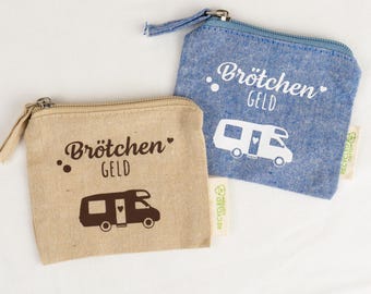 May include: Two small zippered pouches made of fabric. One is beige with dark brown text reading Brötchen GELD and a camper graphic. The other is blue with white text reading Brötchen GELD and a camper graphic. Both have a small tag.