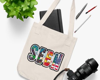 Sacola tote "Seen" do Orgulho LGBTQ: Bandeira americana de arco-íris em algodão orgânico