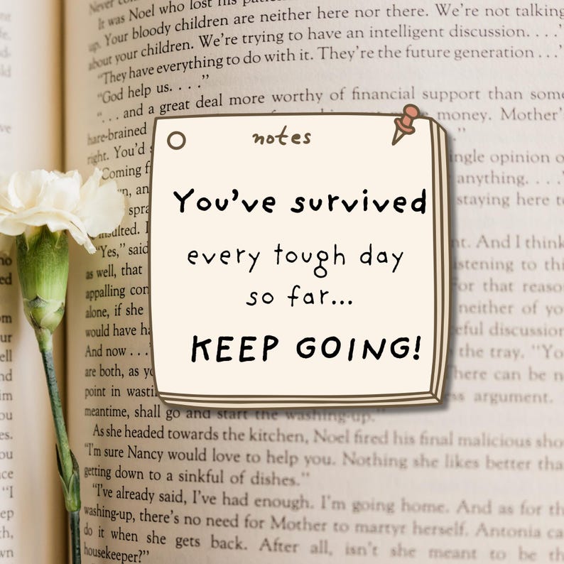 May include: A square cream-colored sticky note with a brown pushpin at the top right corner. The note features the word notes at the top and the text You've survived every tough day so far... KEEP GOING! in a dark brown handwritten font.