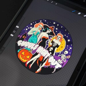 May include: A circular graphic illustration featuring three stylized figures in Halloween-themed attire against a dark purple starry sky. The text GHOULS NIGHT OUT is displayed in white. Elements include a jack-o'-lantern, a skeleton, and a yellow moon.