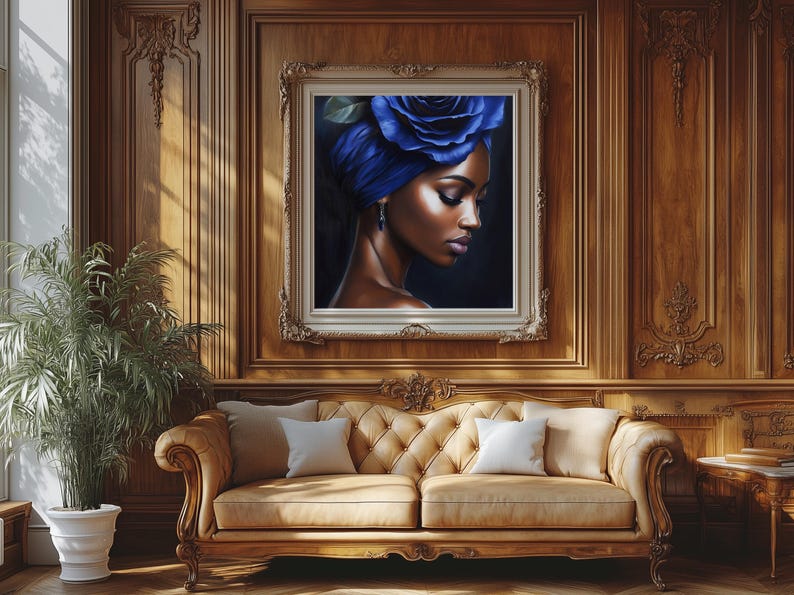 May include: A framed painting of a woman with a blue flower in her hair. The woman has dark skin and is wearing a blue turban. The background is a dark blue.
