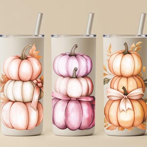 May include: Three stainless steel tumblers with stacked pumpkin designs. Each tumbler features a different colour scheme: peach, pink, and orange. The pumpkins are adorned with leaves and bows, and each tumbler has a silver straw.