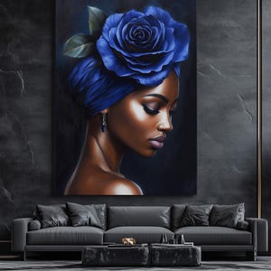 May include: A painting of a woman with dark skin wearing a blue turban with a large blue rose on top. The woman is looking down and her expression is soft. The background is dark blue.