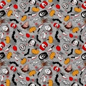 May include: A gray Halloween-themed fabric with a repeating pattern of pumpkins, masks, knives, bats, balloons, and other spooky elements in orange, black, red, and white. The design is suitable for crafting or seasonal decor.