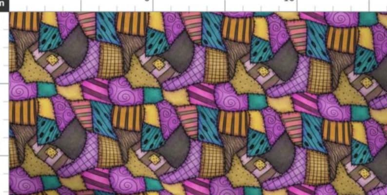 May include: A fabric pattern featuring a repeating patchwork design of boots in shades of purple, teal, yellow, and brown. The print includes various textures such as swirls, stripes, and grids, with a visible ruler at the top showing inches.