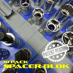 May include: A close-up shot of a blue and gray tool organizer with multiple chrome sockets. The organizer has a grid pattern with numbers printed on it. The text "10 PACK SPACER BLOK" is visible, along with a "PATENT PENDING" stamp.