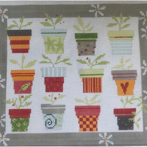 May include: A set of 16 colorful potted plants with various patterns and designs. The plants are all in different colored pots with a variety of patterns, including stripes, polka dots, and floral designs. The pots are arranged in a grid pattern on a white background.