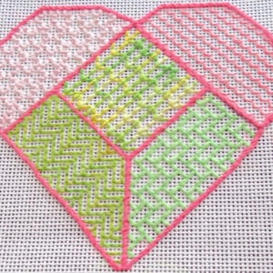 May include: A pink heart-shaped embroidery design with different stitch patterns in shades of pink, green, and yellow.