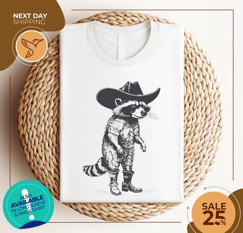 a white shirt with a raccoon wearing a cowboy hat