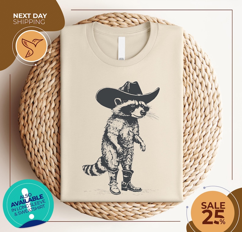 a t - shirt with a raccoon wearing a cowboy hat