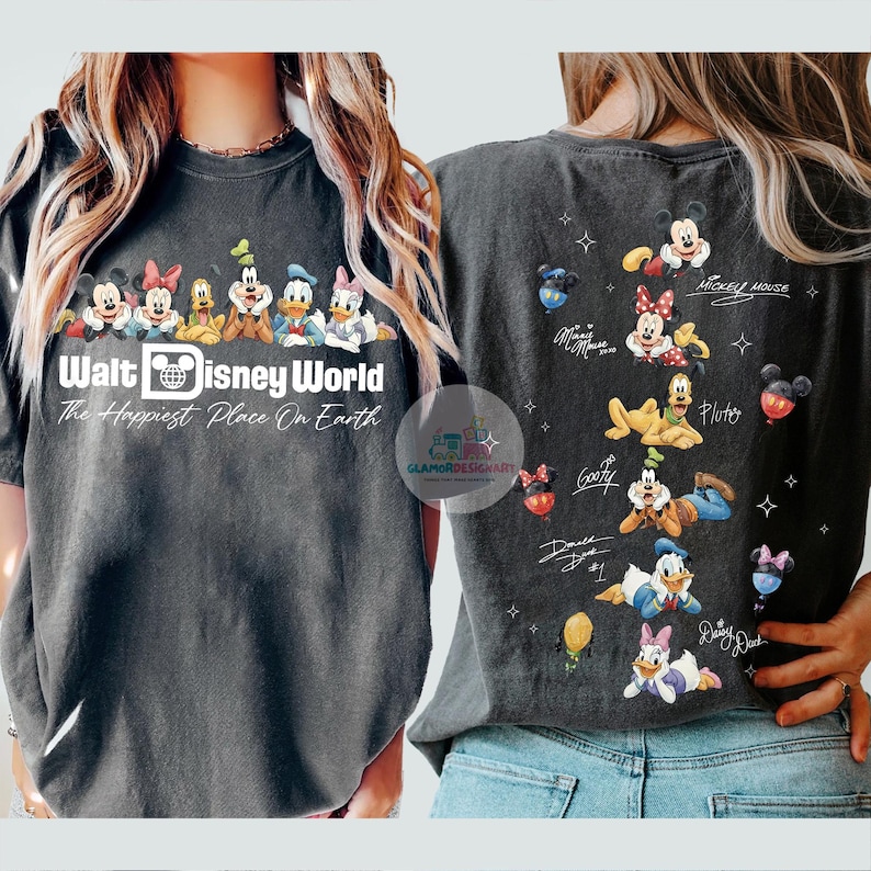 May include: Dark grey t-shirt with a Walt Disney World design. It features Mickey Mouse, Minnie Mouse, and other characters. The front of the shirt has the text "Walt Disney World The Happiest Place On Earth."