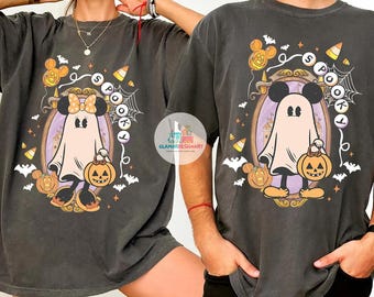 May include: Dark gray t-shirts with a Halloween-themed graphic. The design features a ghost wearing Mickey Mouse ears and holding a jack-o'-lantern, surrounded by pumpkins, bats, and the word "Spooky".
