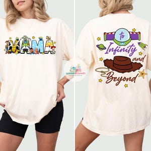 May include: A white t-shirt with a graphic of the Toy Story characters spelling out "MAMA" on the front and the text "To Infinity and Beyond" with a cowboy hat and spaceship on the back.