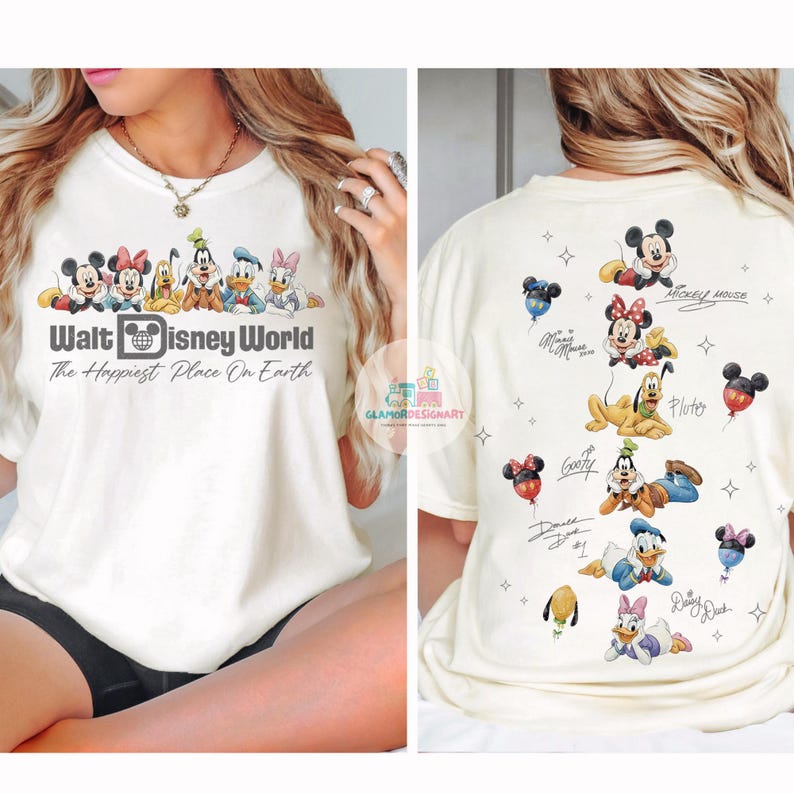 May include: Cream-coloured t-shirt featuring a Walt Disney World graphic with Mickey Mouse, Minnie Mouse, Donald Duck, and other characters. The back of the shirt displays additional Disney characters and signatures.