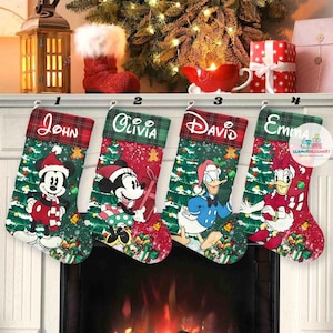 May include: Four Christmas stockings with names John, Olivia, David, and Emma. Each stocking features a different Disney character: Mickey Mouse, Minnie Mouse, Donald Duck, and Daisy Duck. The stockings are red with Christmas tree and gift box designs.