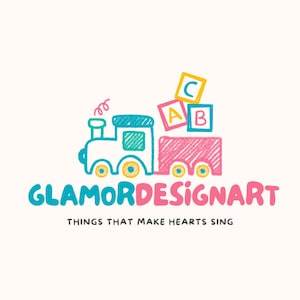May include: A colorful logo for a business called "GlamorDesignArt" with the tagline "Things that make hearts sing". The logo features a cartoon train with a pink boxcar and a blue engine pulling a stack of colorful blocks with the letters "C", "A", and "B" on them.