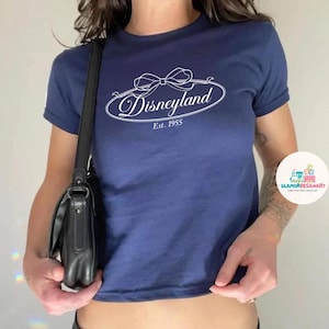 Coquette bow Disneyland Baby tee, Girly Disney Girl Trip Shirt womens T-shirt, Disney Matching Trip Croptop Girly aesthetic baby tee