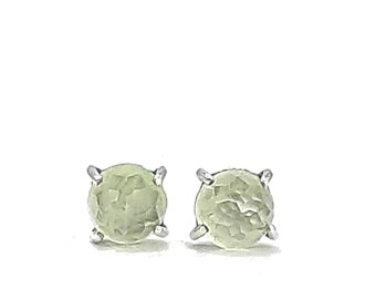 May include: A pair of silver stud earrings with a light green, textured gemstone in each.
