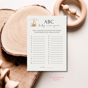 以下が含まれることがあります： 「ABC baby name game」というタイトルの印刷可能なベビーシャワーゲームカード。ゲームのルールは、アルファベットの各文字に名前を書くことです。最初にすべてを記入した人が勝ちます。