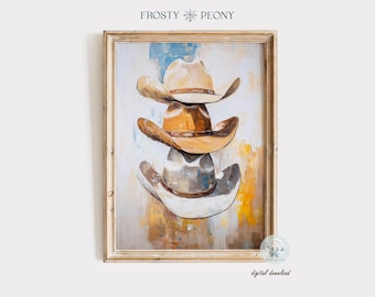 May include: A framed art print featuring an abstract painting of three stacked cowboy hats in shades of tan, brown, and gray. The artwork has a textured, painterly style with a neutral background and the text "Frosty Peony" at the top.