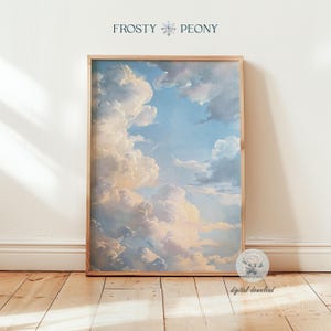 Puede incluir: Una impresión enmarcada de una pintura que representa un cielo azul con nubes blancas y esponjosas. Las nubes están dispuestas en un patrón en capas, con algunas nubes que parecen más cerca del espectador que otras. El cielo es de un color azul claro y las nubes son de un blanco suave.