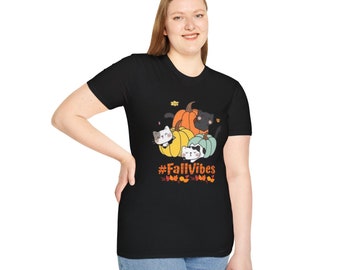 May include: Black t-shirt with a graphic of three cartoon cats inside of pumpkins. The text "#FallVibes" is below the pumpkins.