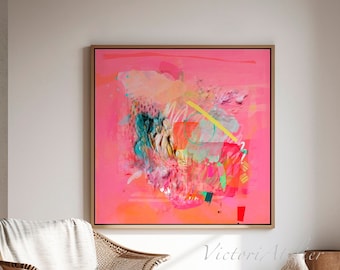 May include: Large abstract painting with a vibrant pink and orange color palette. The artwork features a mix of brushstrokes and textures, framed in a natural wood. A woven chair and neutral rug complete the modern interior.