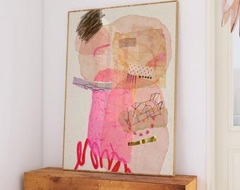 May include: Abstract art print with pink, orange, and brown hues, framed in gold. The artwork is displayed above a wooden chest. A curved sofa with a brown pillow and a decorative chandelier are in the foreground.