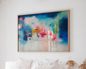 May include: Abstract painting in shades of blue, pink, yellow, and green. The painting is framed in a light wood frame and is hanging on a white wall above a white bed with a white duvet cover and white pillows.