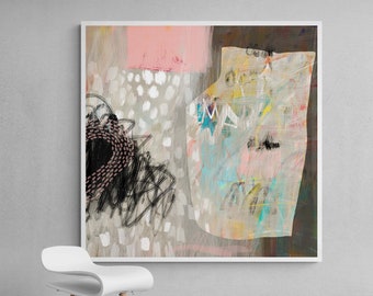 May include: Abstract painting with a white frame. The painting features a large, light pink and white shape with a smaller, darker shape in the center. The background is a light gray with white dots.